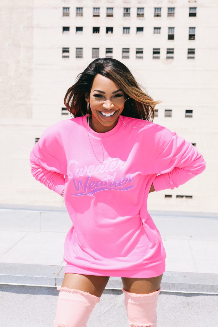 malika haqq slogan sweater